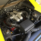 The engine’s tube frame is more primitive than that of its successor, the F355. Also primitive are the compact intake manifolds, which probably don’t have any form of airflow optimisation. No dual-mode shocks.